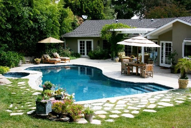 linda yard backyard pool patio grass paving stones outdoor furniture teak house exterior