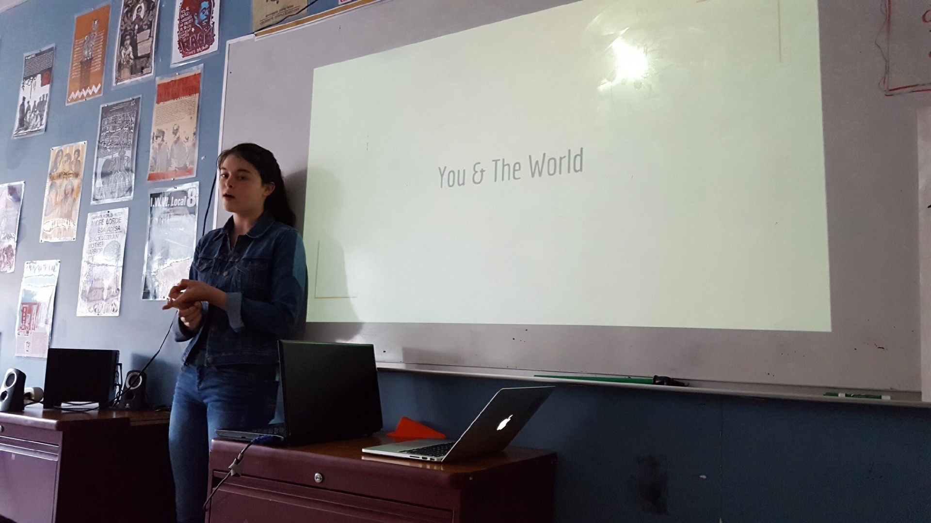 This photo was taken by Nasya Ie during my Agent of Change presentation. It shows me explaining the You & The World project.