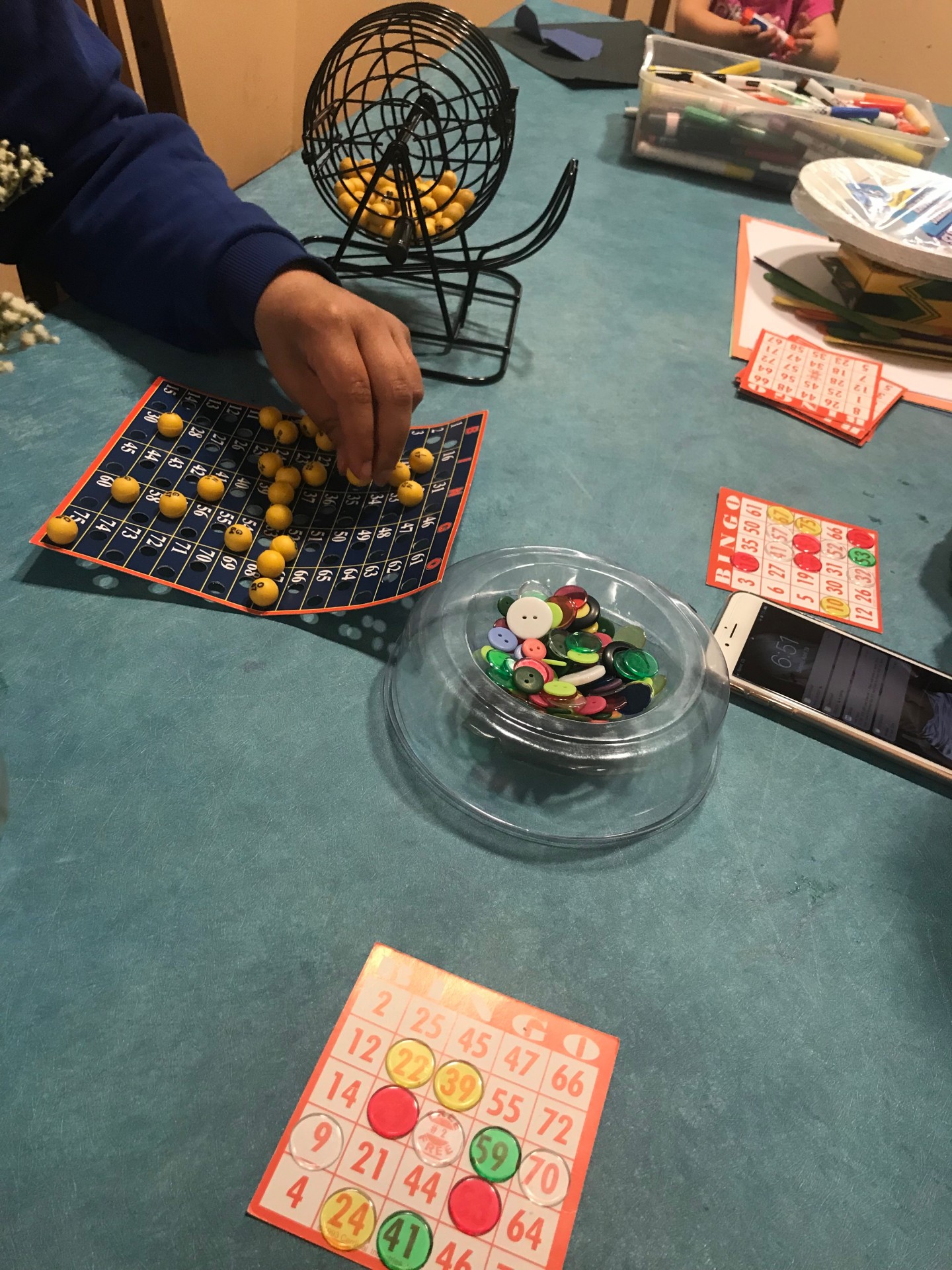 kids playing bingo with Ms. Hernandez