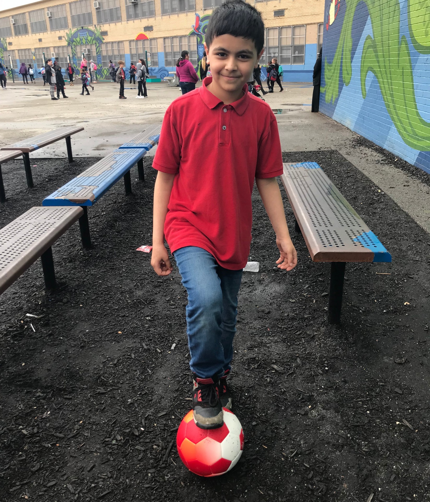 Seraj, a refugee from Syria, playing with the soccer balls I provided to HIAS.