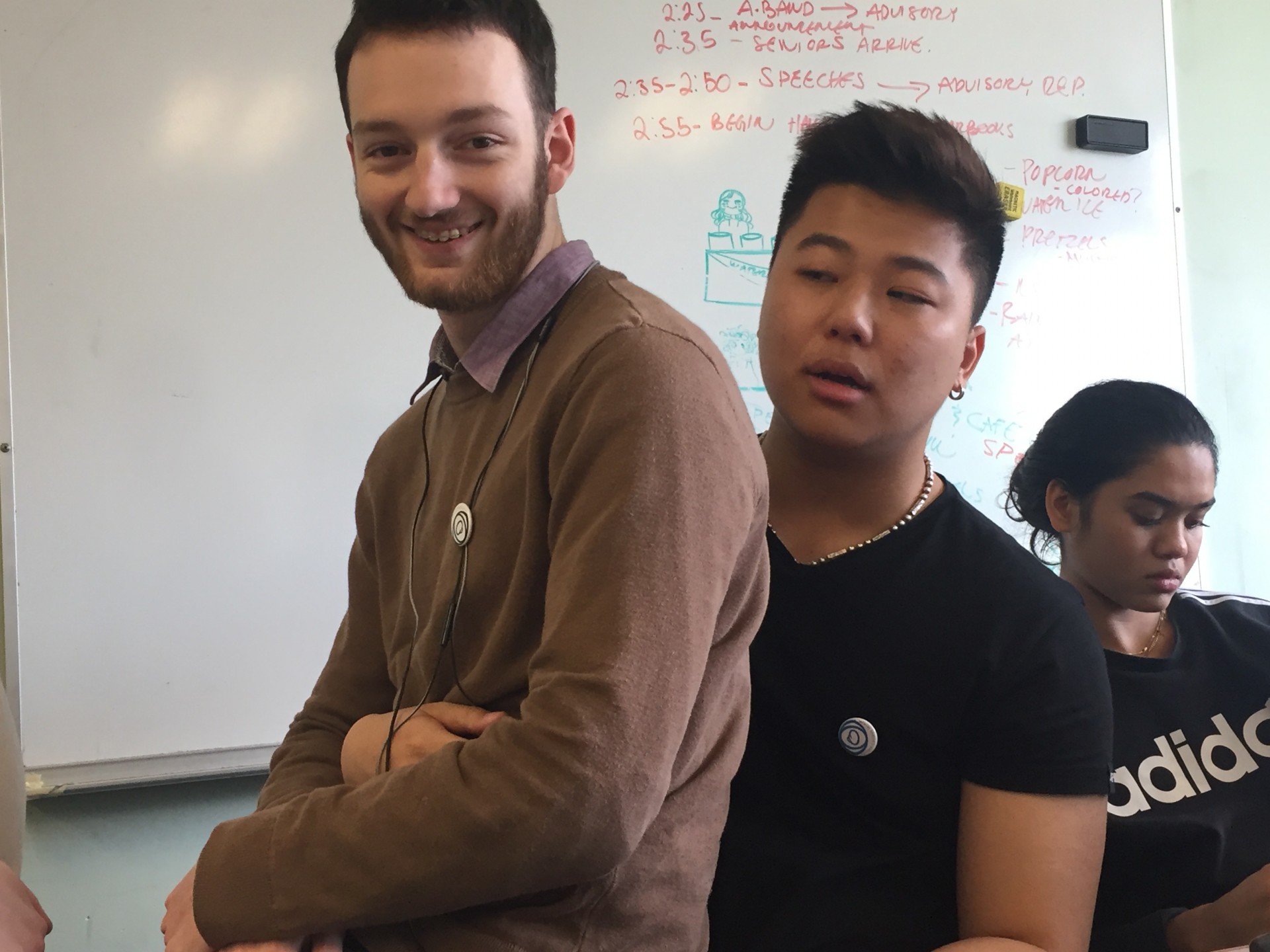 The boys repping their pins during class