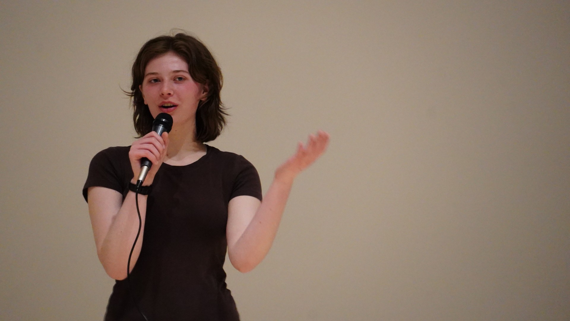 Photo by Xen Gadsden - Clara Hensley speaking to school in assembly before students went to workshops.
