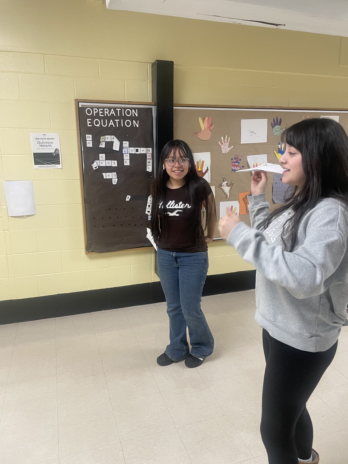 Students participating in the paper airplane competition
